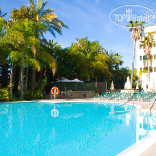 Фото Guadalpin Suites