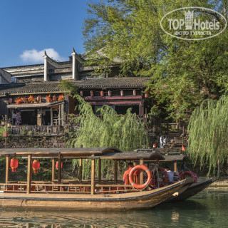 Фото Fenghuang Zui Xiang Xi Hotel